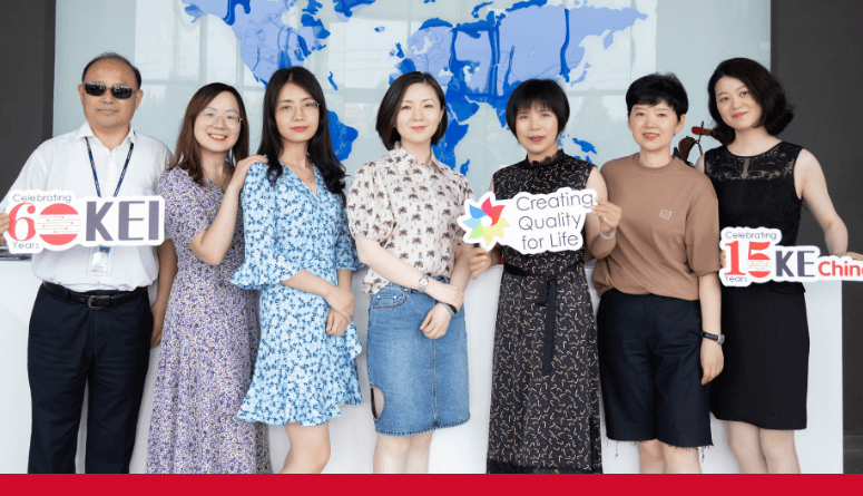 Asian kimball employees celebrating 60 years of KEI