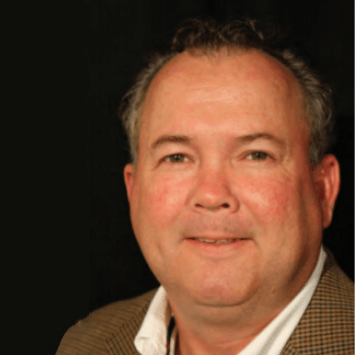 portrait of Jamey Mann, White male on black background